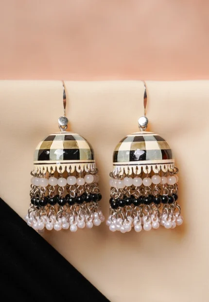 Fusion-style silver-tone jhumka earring featuring intricate floral meenakari artwork, a dome-shaped silhouette, and circular pearl bead embellishments.