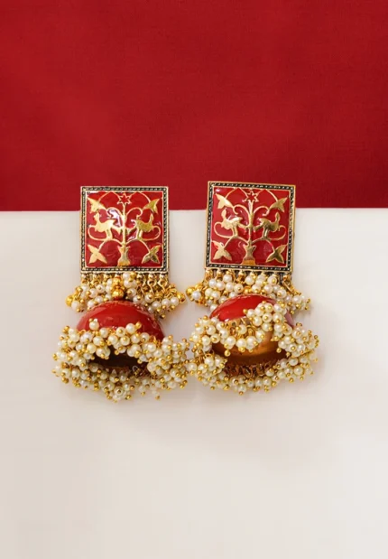 Vintage-inspired oxidized silver jhumka earring with an intricately detailed circular top, chain tassel layers, and small ghungroo embellishments and a push back closure.
