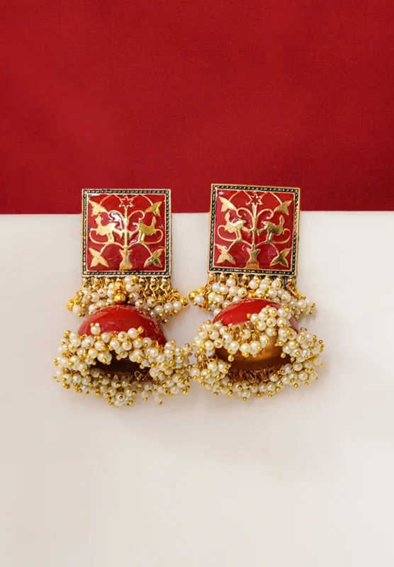 Vintage-inspired oxidized silver jhumka earring with an intricately detailed circular top, chain tassel layers, and small ghungroo embellishments and a push back closure.