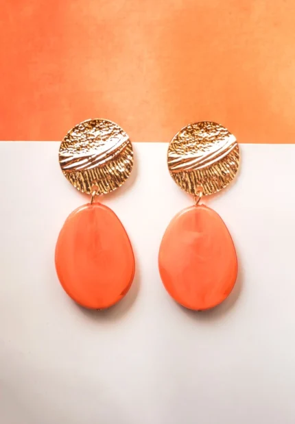 Vibrant bright orange acrylic dangle earring featuring a soft matte texture, an elegant gold-tone top, and a push-back fastening