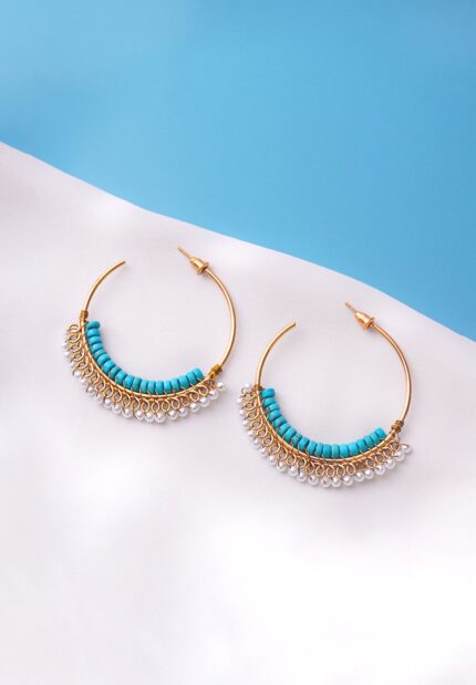 Chic open-end hoop earrings in gold with aqua blue and pearl white hues, decorated with a row of turquoise cylindrical beads and a fringe of small white pearl-like beads, secured with a push back post