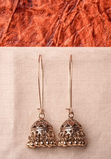 Lovely antique-finish metal chain jhumka earrings with a floral design, delicate dangling metallic beads, a classic dome-shaped design, and a push-back closure