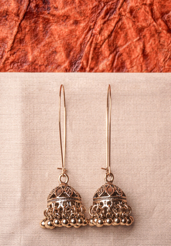 Lovely antique-finish metal chain jhumka earrings with a floral design, delicate dangling metallic beads, a classic dome-shaped design, and a push-back closure