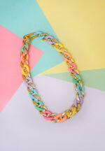 Fashion-forward necklace with a bold chain-link design, featuring gold-tone and vibrant multicolor metal links, secured with a golden hook clasp.