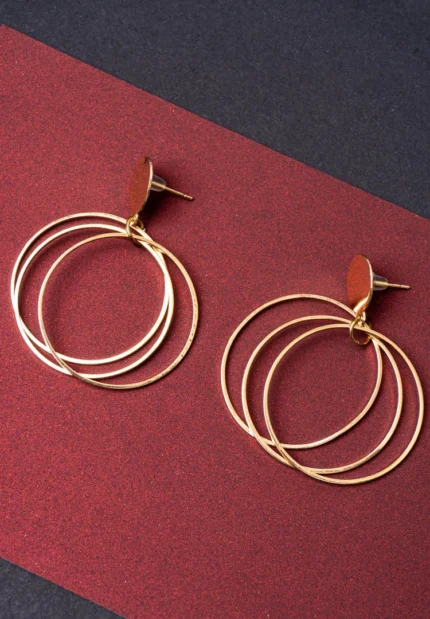 Chic metal hoop earrings featuring a dangling interconnected, and a push back for easy wear.