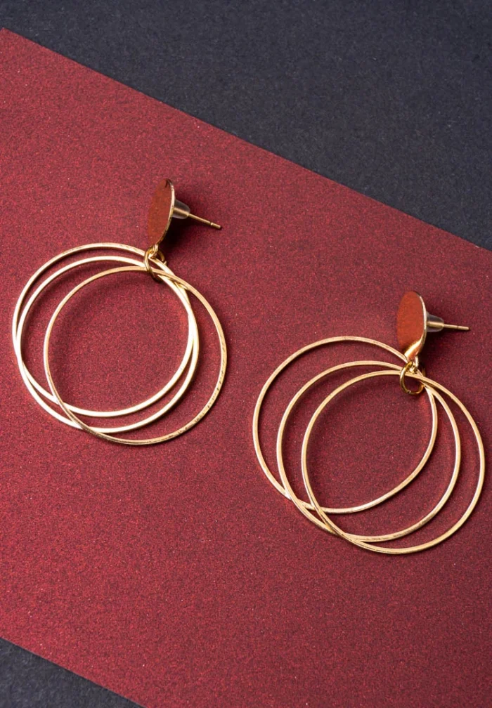 Chic metal hoop earrings featuring a dangling interconnected, and a push back for easy wear.