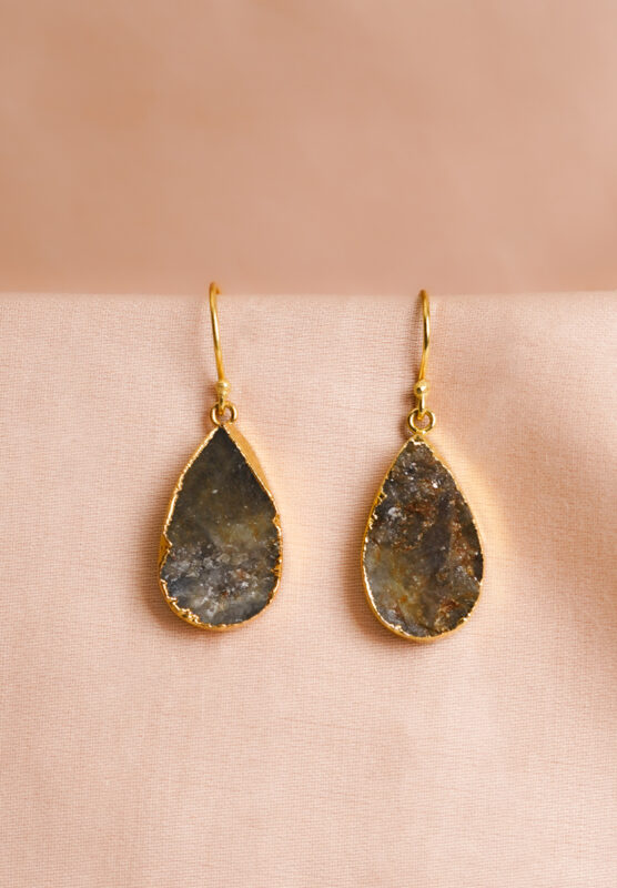 Chic teardrop-shaped metal drop earrings with a gold/moss green finish, showcasing a raw gemstone in an earthy gray and brown mix with a soft shimmer, and a curved hook closure
