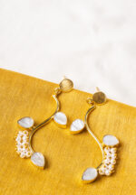 Elegant metal drop earrings in a polished gold, dark pink, and pearl white finish, showcasing overlapped oval links, a purple marble-textured stone, and delicate dangling pearls, finished with a push-back closure