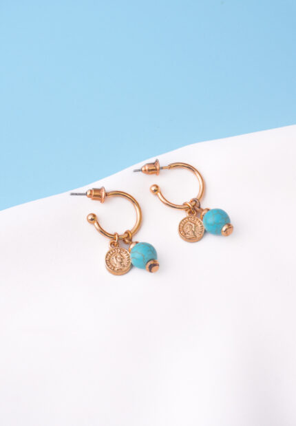 Trendy mini C-hoop earring with a polished gold-tone/turquoise finish, adorned with a turquoise bead and a small vintage-inspired coin charm, push-back post