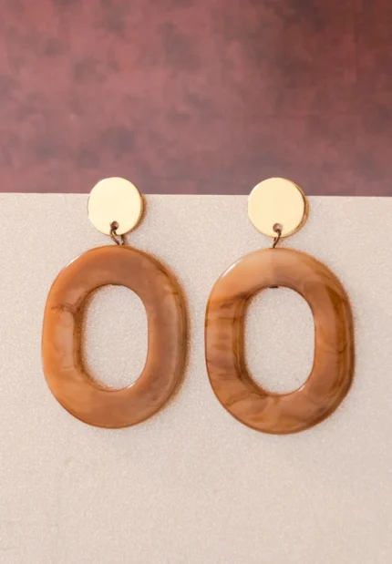 Chic oval resin drop earrings with a sleek geometric design, accented by a gold-tone top and finished with a push-back closure.