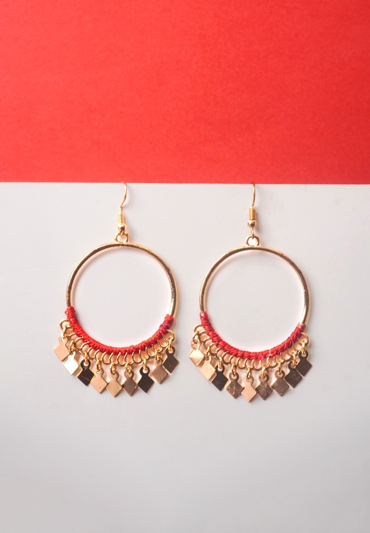 214-Th Chic metal hoop earrings featuring a polished golden-tone finish/crimson red,cherry red finish adorned with red coloured tread wrapped in the bottom with dangling small diamond-shaped golden charms and french hook closure.