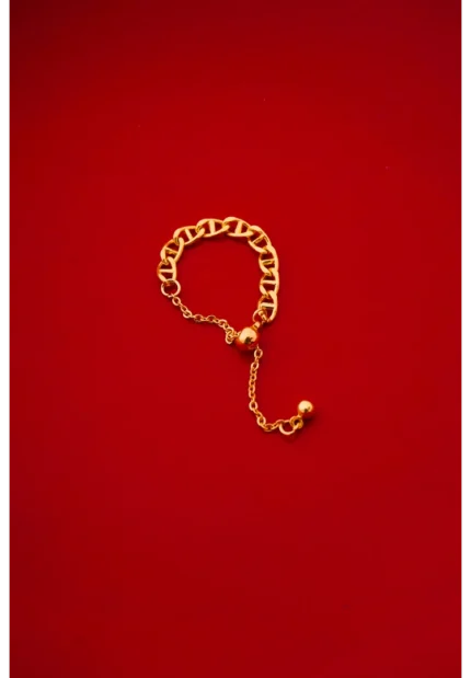 Elegant gold-tone rope chain ring featuring a delicate design with an adjustable slider at the bottom for a custom fit.