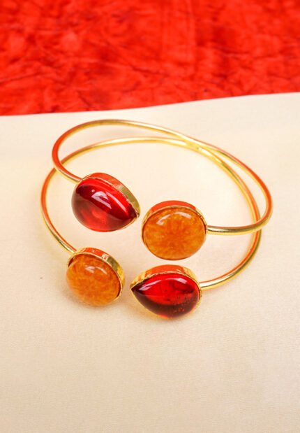 Elegant metal cuff bracelet showcasing teardrop and circular design at the edges, beautifully enhanced with a lively mix of vibrant colors