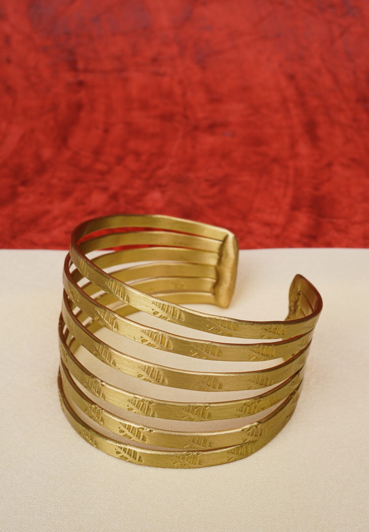 292-Th Elegant metal cuff bracelet showcasing teardrop and circular design at the edges, beautifully enhanced with a lively mix of vibrant colors