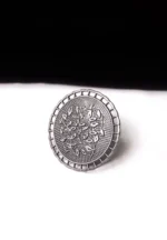 Artisan-crafted oxidized silver-tone statement ring with intricate floral embellishments and a prominent leafy design in the center
