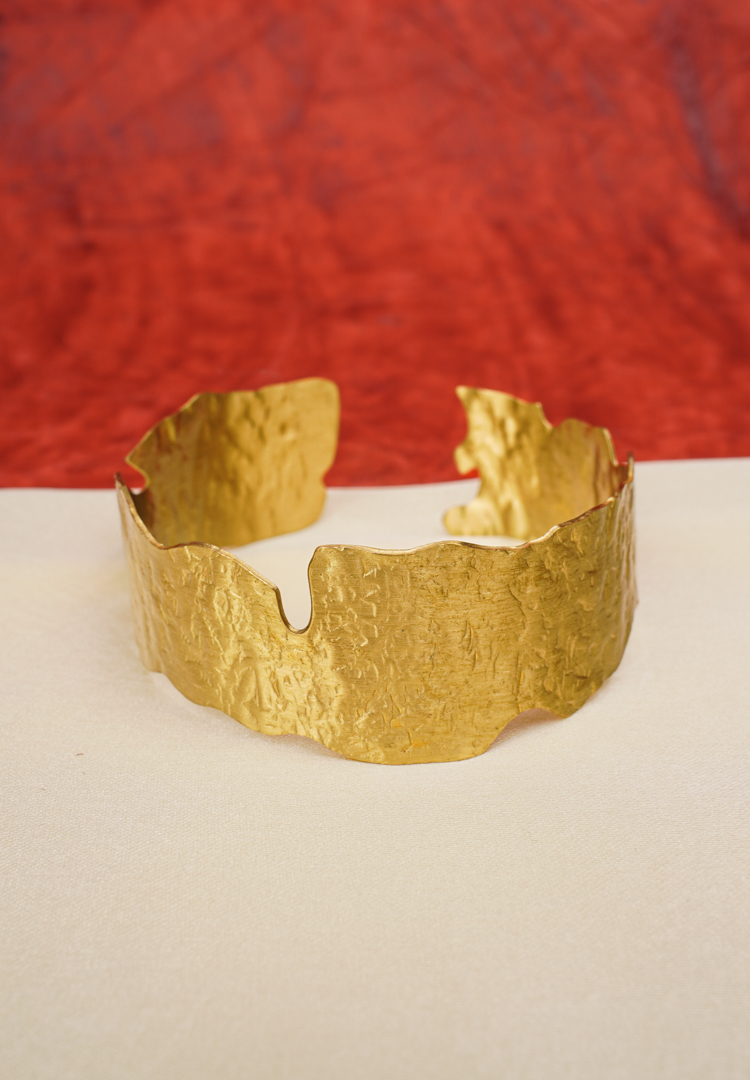 327-Th Elegant metal cuff bracelet showcasing teardrop and circular design at the edges, beautifully enhanced with a lively mix of vibrant colors.