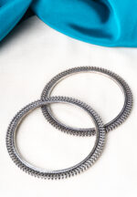 Antique-inspired oxidized silver-tone bangle set with finely detailed lines and circular metallic beaded designs