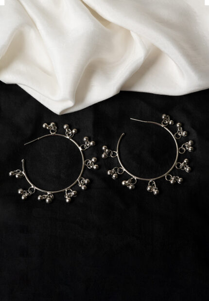 Delicately designed oxidized silver C hoop earring adorned with dangling ghungroos and finished with a push-back closure