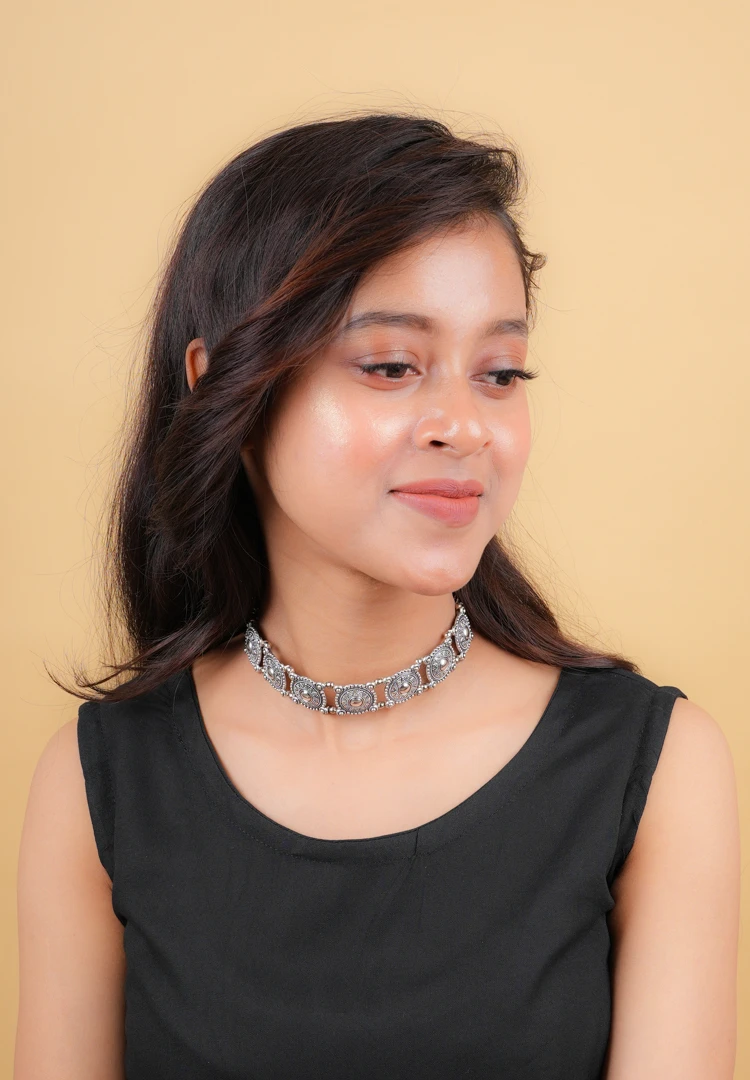 340-3 Classic choker necklace adorned with a series of detailed circular patterns, creating an artistic and bold look with an S-hook clasp.