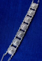 Classic choker necklace adorned with a series of detailed circular patterns, creating an artistic and bold look with an S-hook clasp.