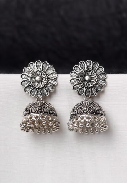 Oxidised jhumka earrings with complex floral detailing, featuring a finely detailed floral top, delicate detailing, and ghungroos at the bottom, secured with a push-back closure