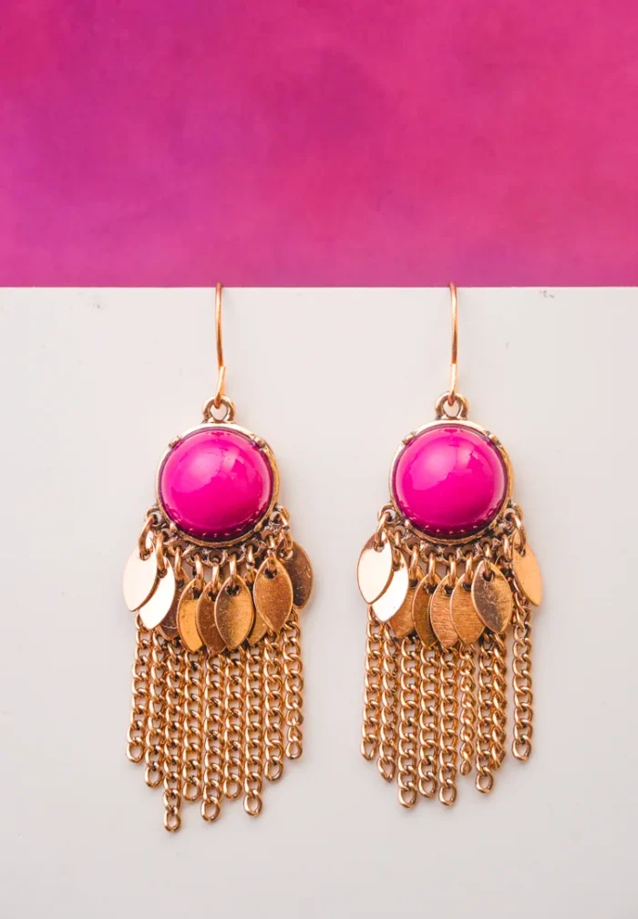 Sleek and contemporary dangle earrings with a coiled spiral structure, finished in a silver tone and secured with a push-back post.