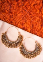 Ethnic metal drop earrings in an antique gold-tone finish, featuring a crescent design with fine bead detailing and dangling ghungroos, designed with a hinged back for secure wear.