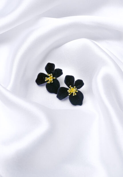 Delicate flower stud earring with a gold-tone finish, red roses and green leaves gemstone textured golden center, and a hinged back.