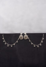 Antique-style silver-tone jhumka ear hair chain earring featuring circular top, a chain tassel detailed with pearl beads and a delicate chain with circular line charms, finished with a push-back closure, with ghungroos at the end with a curved hook closure