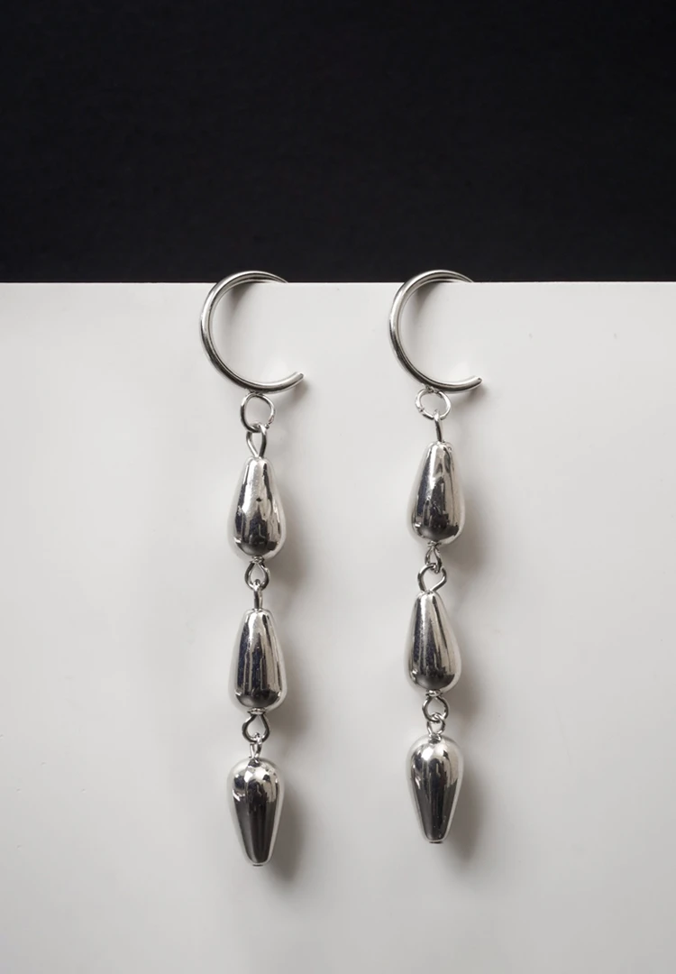 120th Trendy mini C-hoop earring with a polished silver/golden-tone chain links suspends three polished teadrop charms and a small vintage-inspired coin charm, push-back post