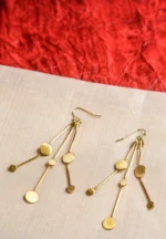Chic geometric brass earrings with a lightweight design, featuring three slinging stem-like wires adorned with evenly spaced circular discs, secured with a French hook.