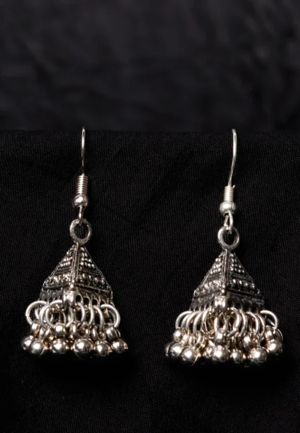 Antique-inspired oxidized silver-tone triangular jhumka earring, showcasing fine craftsmanship with ghungroos along the edge and a secure French hook closure.