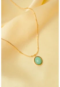 Minimalist gold-tone bracelet with a fine satellite chain, a sleek curved rectangular bar, and a petite orange heart charm, finished with a secure lobster claw clasp.