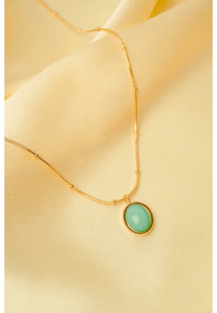 Minimalist gold-tone bracelet with a fine satellite chain, a sleek curved rectangular bar, and a petite orange heart charm, finished with a secure lobster claw clasp.