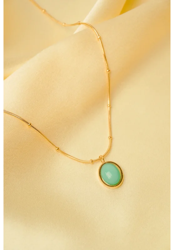 Minimalist gold-tone bracelet with a fine satellite chain, a sleek curved rectangular bar, and a petite orange heart charm, finished with a secure lobster claw clasp.