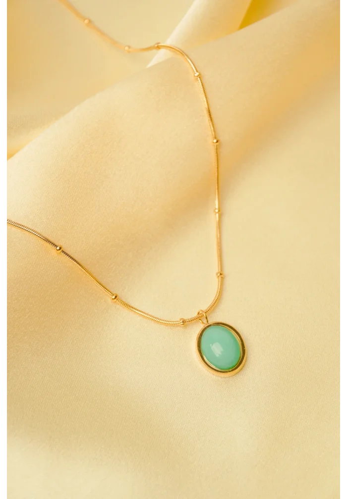 Minimalist gold-tone bracelet with a fine satellite chain, a sleek curved rectangular bar, and a petite orange heart charm, finished with a secure lobster claw clasp.