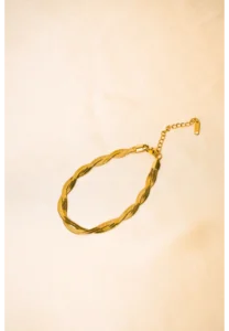 Elegant adjustable curb chain bracelet in a gold-tone finish, featuring a curved metallic wire centerpiece with a dangling spherical charm and a secure spring ring clasp.