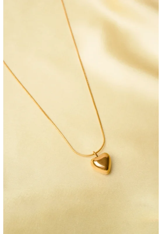 Trendy gold-tone rope chain necklace with a circular pendant, elegantly designed with a glittery silver inlay and a rose engraving, secured with a lobster claw clasp.