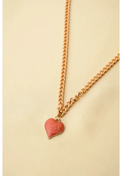 Elegant adjustable curb chain bracelet in a gold-tone finish, featuring a curved metallic wire centerpiece with a dangling spherical charm and a secure spring ring clasp.