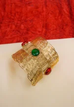 Elegant metal cuff bracelet showcasing teardrop and circular design at the edges, beautifully enhanced with a lively mix of vibrant colors.