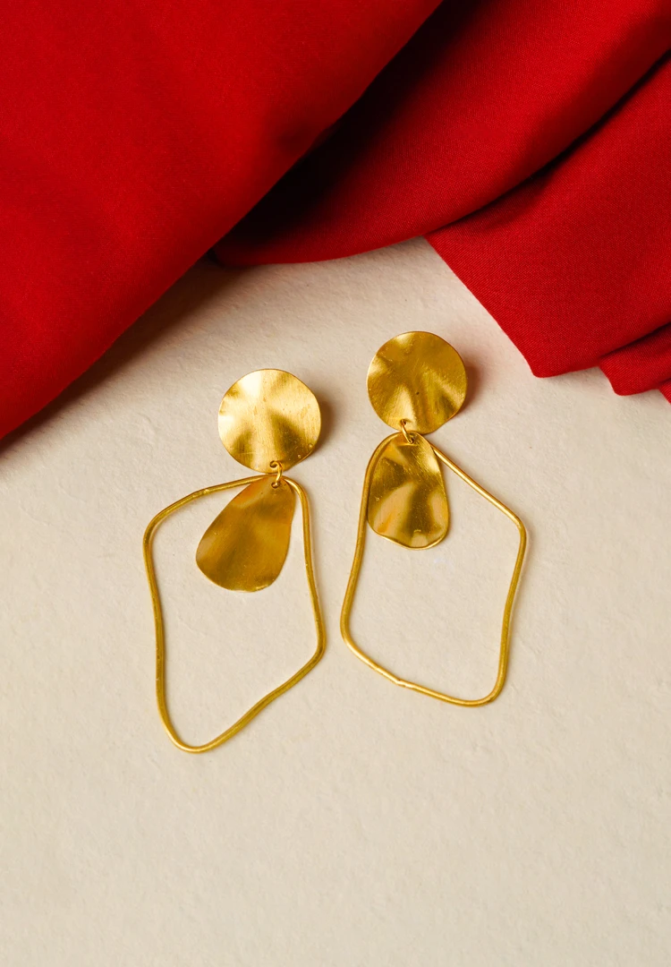 357-Th Minimalist brass earrings with an irregular design, subtle texture detailing, and a classic push-back closure.