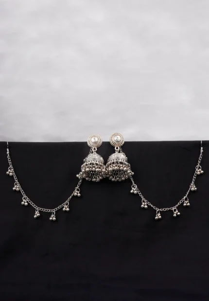 Antique-style silver-tone jhumka ear hair chain earring featuring circular top, a chain tassel detailed with pearl beads and a delicate chain with circular line charms, finished with a push-back closure, with ghungroos at the end with a curved hook closure.