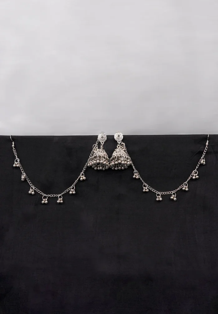 Antique-style silver-tone jhumka ear hair chain earring featuring teadrop top, a chain tassel detailed with pearl beads and a delicate chain with circular line charms, finished with a push-back closure, with ghungroos at the end with a curved hook closure.