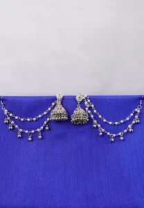 Antique-style silver-tone jhumka ear hair chain earring featuring teadrop top, triangular jhumkas having chain tassel detailed with pearl beads and a delicate chain with circular line charms, finished with a push-back closure, with ghungroos at the end with a curved hook closure.