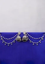 Antique-style silver-tone jhumka ear hair chain earring featuring teadrop top, a chain tassel detailed with pearl beads and a delicate chain with circular line charms, finished with a push-back closure, with ghungroos at the end with a curved hook closure.