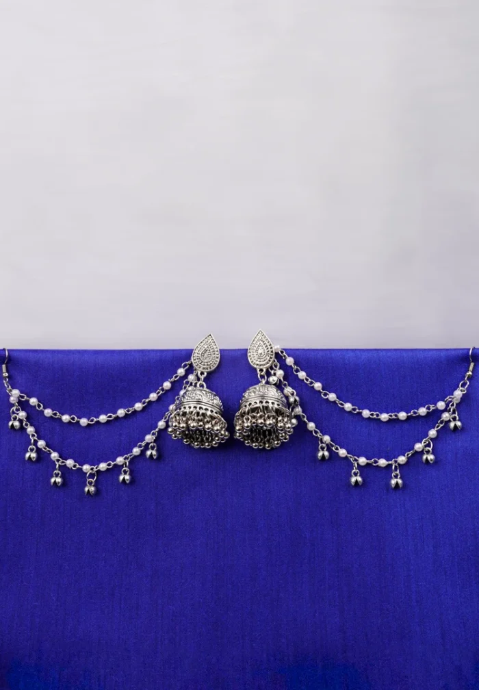 Antique-style silver-tone jhumka ear hair chain earring featuring teadrop top, a chain tassel detailed with pearl beads and a delicate chain with circular line charms, finished with a push-back closure, with ghungroos at the end with a curved hook closure.