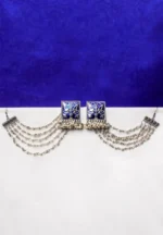 Ethnic-inspired silver-tone geometric ear hair chain earring with an intricately detailed square centerpiece, blue enamel inlay, pearl-studded chain tassels, and a series of delicate charms with ghungroos.