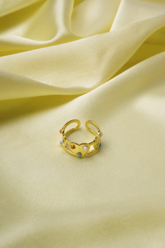 Stylish gold-tone adjustable ring featuring heart motifs, each set with dazzling colorful gemstones