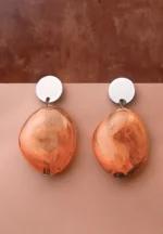 Chic oval resin drop earrings with a sleek geometric design, accented by a gold-tone top and finished with a push-back closure.