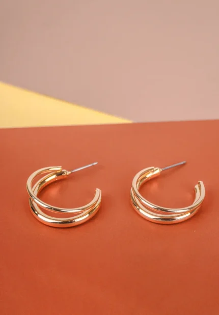 Trendy mini C-hoop earring with a polished silver-tone, golden tone/crimson red finish featuring dangling reddish stone chip beads at the bottom and , push-back post.